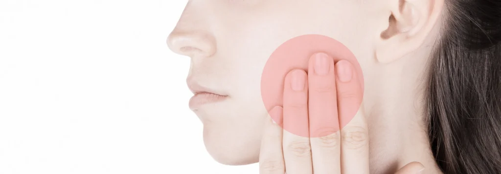 Femme souffrant de douleur à la mâchoire ATM – occlusodontie Cabinet le 42 Toulouse